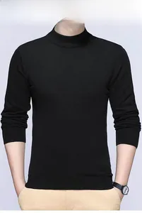 Detail view of men's black slim-fit knitted sweater with ribbed cuffs and hem