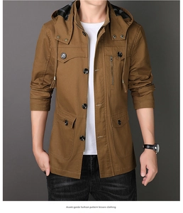 Détail de veste utilitaire marron à capuche avec double fermeture et multiples poches