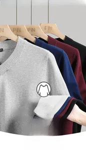 Detailed view of V-neck knitted cotton sweaters featuring ribbed cuffs in multiple colors