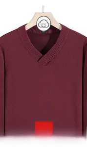 Detailed close-up of a burgundy men's V-neck cotton knit sweater on a hanger