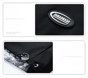 Detail of DIBAOKASA black jacket featuring rubber logo tag and adjustable hem drawstring