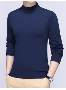 Detail view of navy blue mock neck knit sweater featuring ribbed cuffs and a slim fit cut