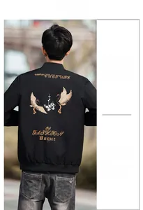 Detailed embroidery of a crane and text on the back of a black men's jacket