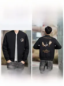 Detail of premium black bomber jacket with intricate crane and floral embroidery