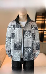 Detail of tiger print patchwork and typographic embroidery on casual men's jacket
