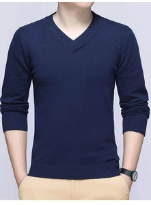Close-up of the classic V-neckline and ribbed knit texture on a dark blue men's sweater