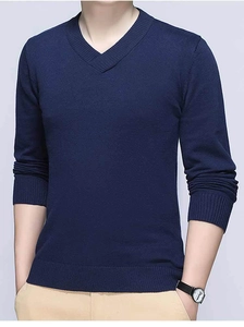 Detail of classic V-neck and ribbed cuffs on navy blue men cotton knitted sweater
