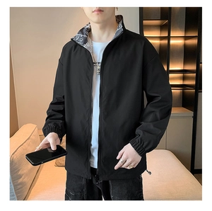Detailed view of black windbreaker jacket with elastic cuffs and inner collar lettering