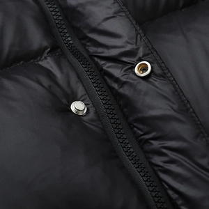 Glossy black long down jacket with premium metal buttons and durable resin zipper detail