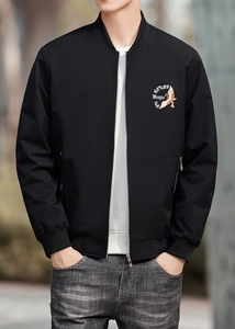 Detail of white crane embroidery and text on black varsity jacket with stand collar