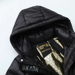 Glossy black hooded down jacket with distinctive gold honeycomb textured lining detail
