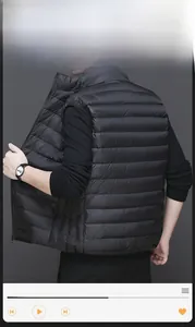Rear view of lightweight black men's down vest with stand collar and horizontal quilting