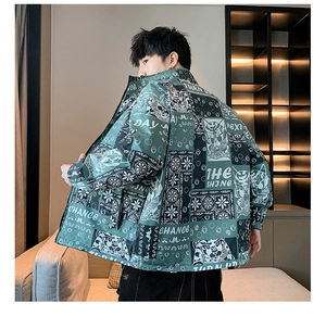 Detail view of dark green casual jacket with paisley and tiger print street style