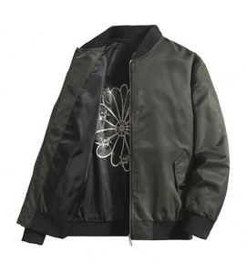 Close-up of olive bomber jacket with black ribbed collar and white floral pattern lining