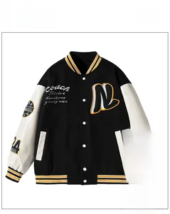 Detailed view of striped ribbed cuffs and hem on a vintage patchwork varsity jacket