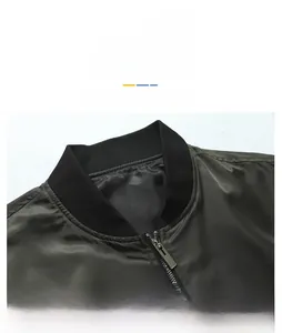 Detail view of olive green bomber jacket featuring a ribbed baseball collar and metal zipper