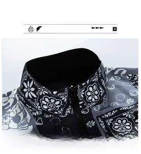 Detailed close-up of a men's stand collar jacket featuring white floral paisley patterns
