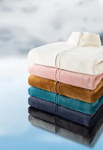 Vertical stack of multi-color outdoor fleece jackets with high collar and full zip