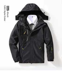 Detail of black waterproof outdoor jacket with yellow zippers and printed chest logo