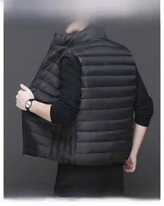 Detail view of men's black quilted down vest with waterproof semi-matte finish and stand collar