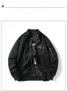 Detail of black pilot jacket featuring gothic embroidery and metallic zipper closure