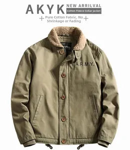 Detail of army green cotton jacket showing sheepskin fleece collar and embroidery