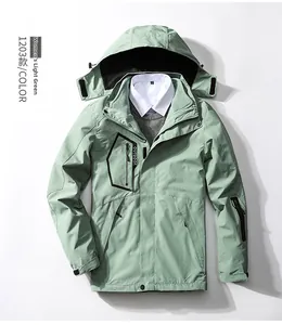 Detail of pea green outdoor jacket with hooded collar and black zipper pockets