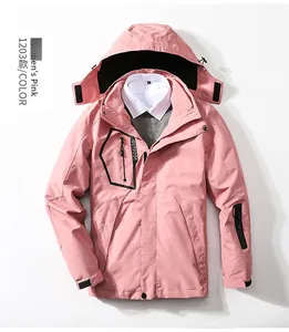 Detail of pink 3-in-1 outdoor jacket featuring a hood, zipper pocket, and velcro cuffs
