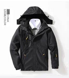 Detail of women's black outdoor jacket with yellow zipper and outdoor logo lettering