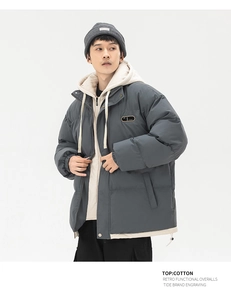 Close-up of winter hooded jacket with double placket and retro functional details