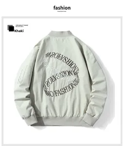 Close-up of the back embroidery design on the khaki oversized varsity bomber jacket