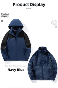 Close-up of the 3-in-1 navy blue outdoor jacket showing the inner fleece and waterproof shell