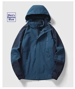 Detail view of denim blue outdoor hooded jacket with functional zippers and sport embroidery