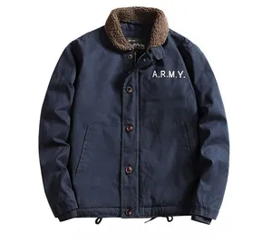 Detail of navy workwear jacket featuring brown sherpa collar and white ARMY lettering print