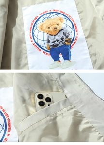 Detail of inner hidden pocket on an American embroidery oversized baseball jacket