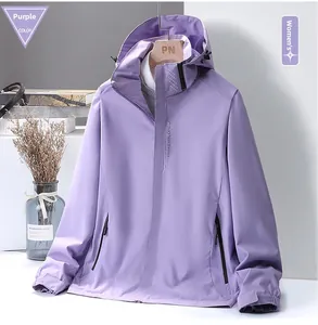 Detail of purple outdoor jacket showing the EXPLORE lettering and windproof pocket