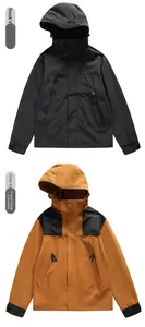 Front view of waterproof mountain jackets in black and caramel colorblock styles