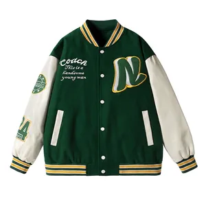 Retro forest green varsity jacket with padded faux leather sleeves and embroidery