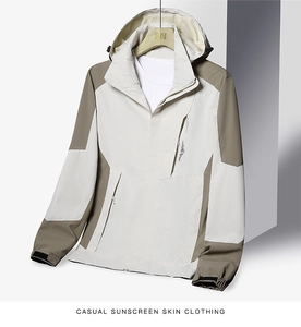 Detailed macro view of hooded jacket with adjustable velcro cuffs and waterproof fabric