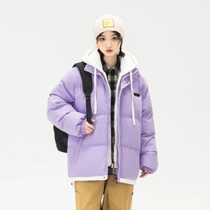 Lavender purple layered puffer jacket with white hoodie and brown cargo pants for women