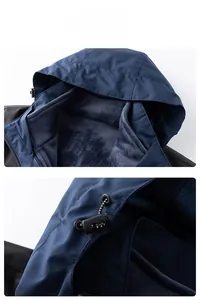 Detail of outdoor jacket showing windproof hood with adjustable elastic drawstring and fleece lining