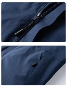 Detail of waterproof main zipper and hidden side pocket on outdoor hiking jacket