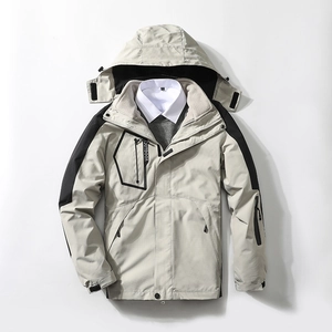 3-in-1 waterproof outdoor jacket in beige and black with detachable hood and pockets