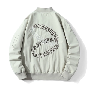Oversized beige bomber jacket with detailed circular back embroidery and ribbed cuffs