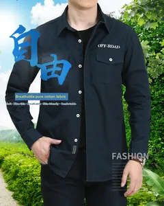 Detail view of dark blue cotton utility shirt featuring double pockets and outdoor embroidery