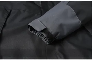Detail of adjustable Velcro cuffs on windproof outdoor jacket with bicolor stitching