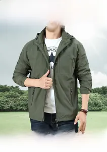 Detail view of military green hooded jacket with windproof fabric and adjustable cuffs