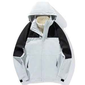 Three-in-one outdoor hiking jacket with light blue and black shell and fleece liner