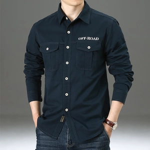 Detail of dark blue men's cotton shirt with chest pockets and white OFF-ROAD text