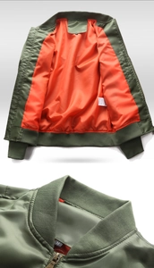 Detail of MA-1 flight jacket showing orange lining and rib-knit collar with metal zipper